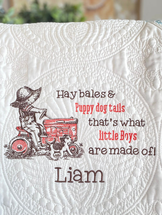 Personalized Little Tractor Boy & Puppy Baby Quilt | Custom Name Heirloom Blanket for Boys featuring embroidered design of a boy on a red tractor with a puppy and the name Liam.
