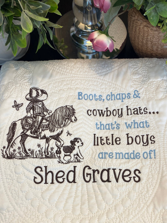 Personalized Little Cowboy on Horse Baby Quilt | Custom Name Heirloom Blanket for Boys featuring embroidered cowboy and dog design with custom name and playful text on a textured white quilt.