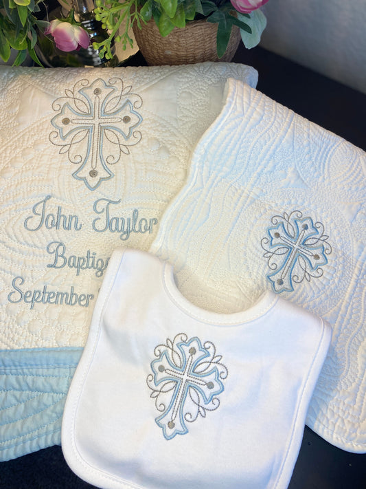 Personalized Scrollwork Cross Baptism Gift Set | Custom Quilt Bib & Burp Cloth Christening Heirloom featuring embroidered cross and custom name with baptism date on a soft quilt, bib, and burp cloth.