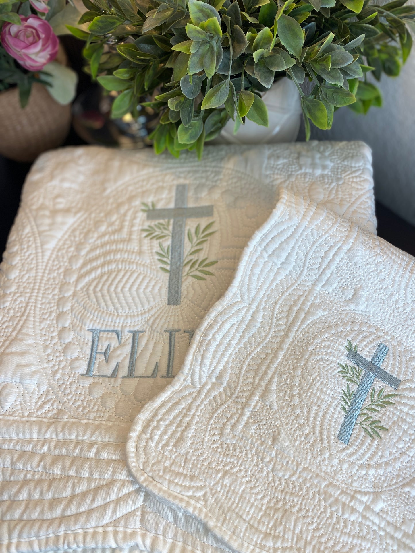 Personalized Laurel Branch Cross Baptism Gift Set | Custom Quilt Bib & Burp Cloth Christening Heirloom featuring detailed white quilting with embroidered cross and greenery design.