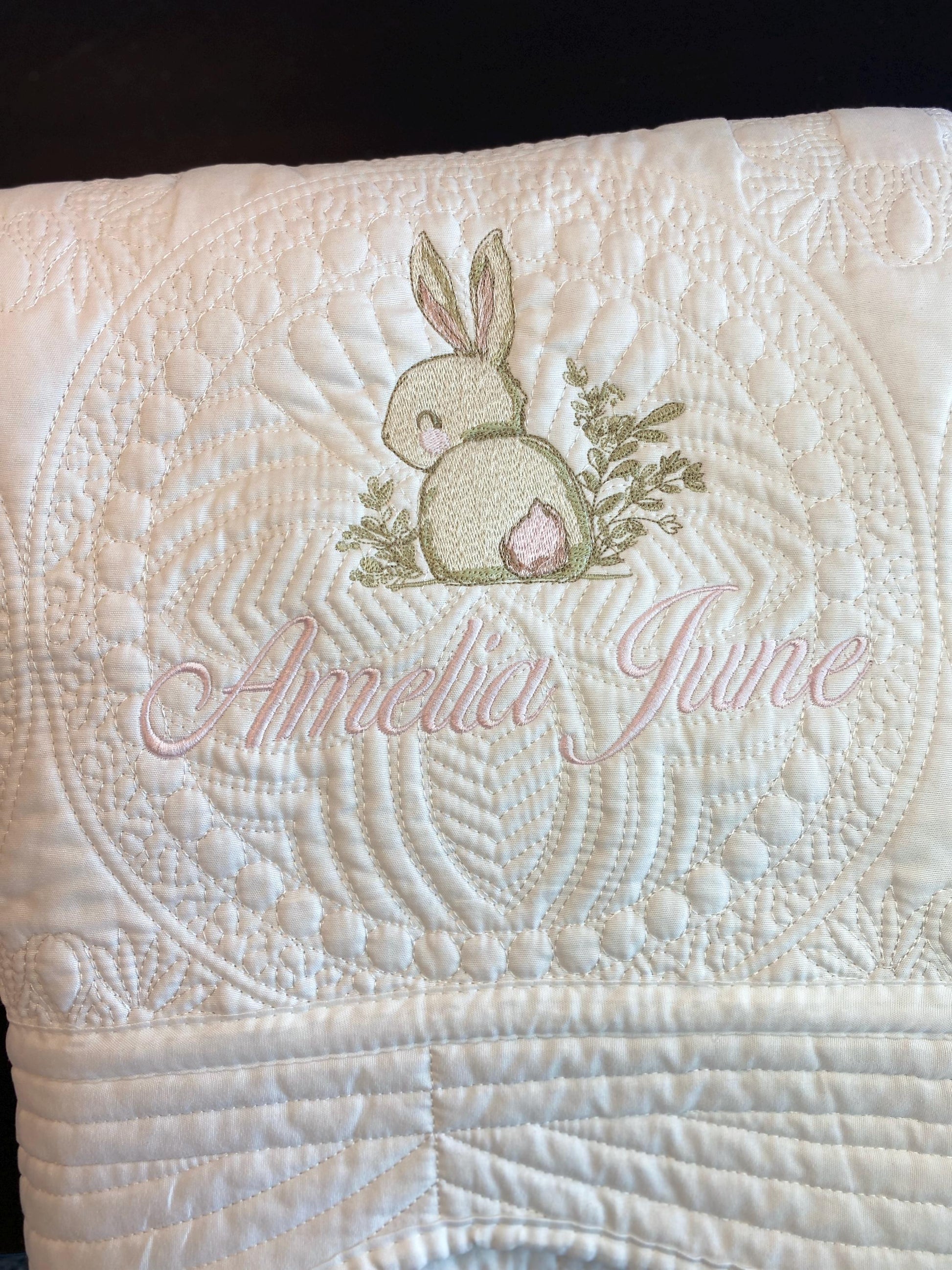 Personalized Embroidered Bunny Rabbit Baby Quilt | Whimsical Heirloom Keepsake | Custom Name Blanket with delicate bunny embroidery and custom name stitching in soft pastel colors.