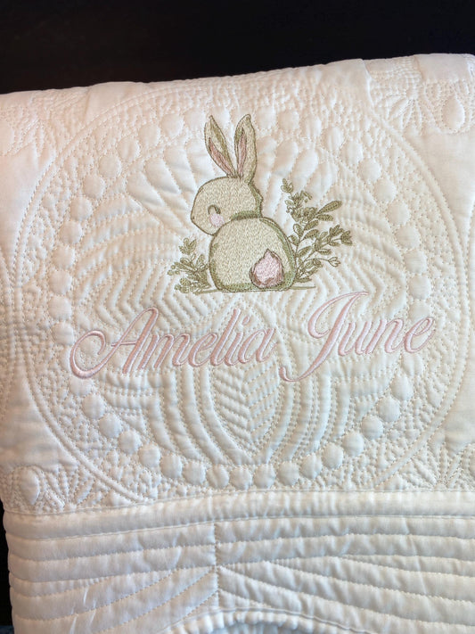 Personalized Embroidered Bunny Rabbit Baby Quilt | Whimsical Heirloom Keepsake | Custom Name Blanket with delicate bunny embroidery and custom name stitching in soft pastel colors.