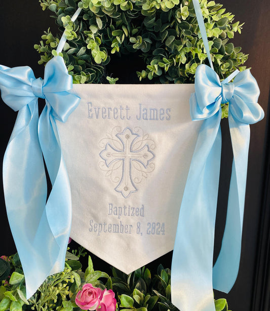 Personalized Embroidered Baptism & Christening Banner | Custom Name Scroll Cross Keepsake with light blue bows, embroidered cross, name Everett James, and baptism date September 8, 2024.