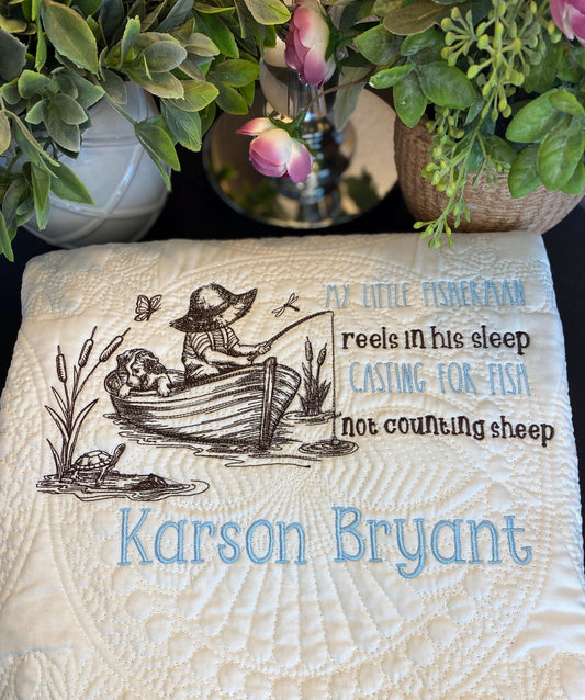 Personalized Little Fisherman Boy & Dog Baby Quilt | Custom Name Heirloom Blanket for Boys featuring a boy fishing with a dog in a boat, embroidered with name Karson Bryant and whimsical text about fishing.