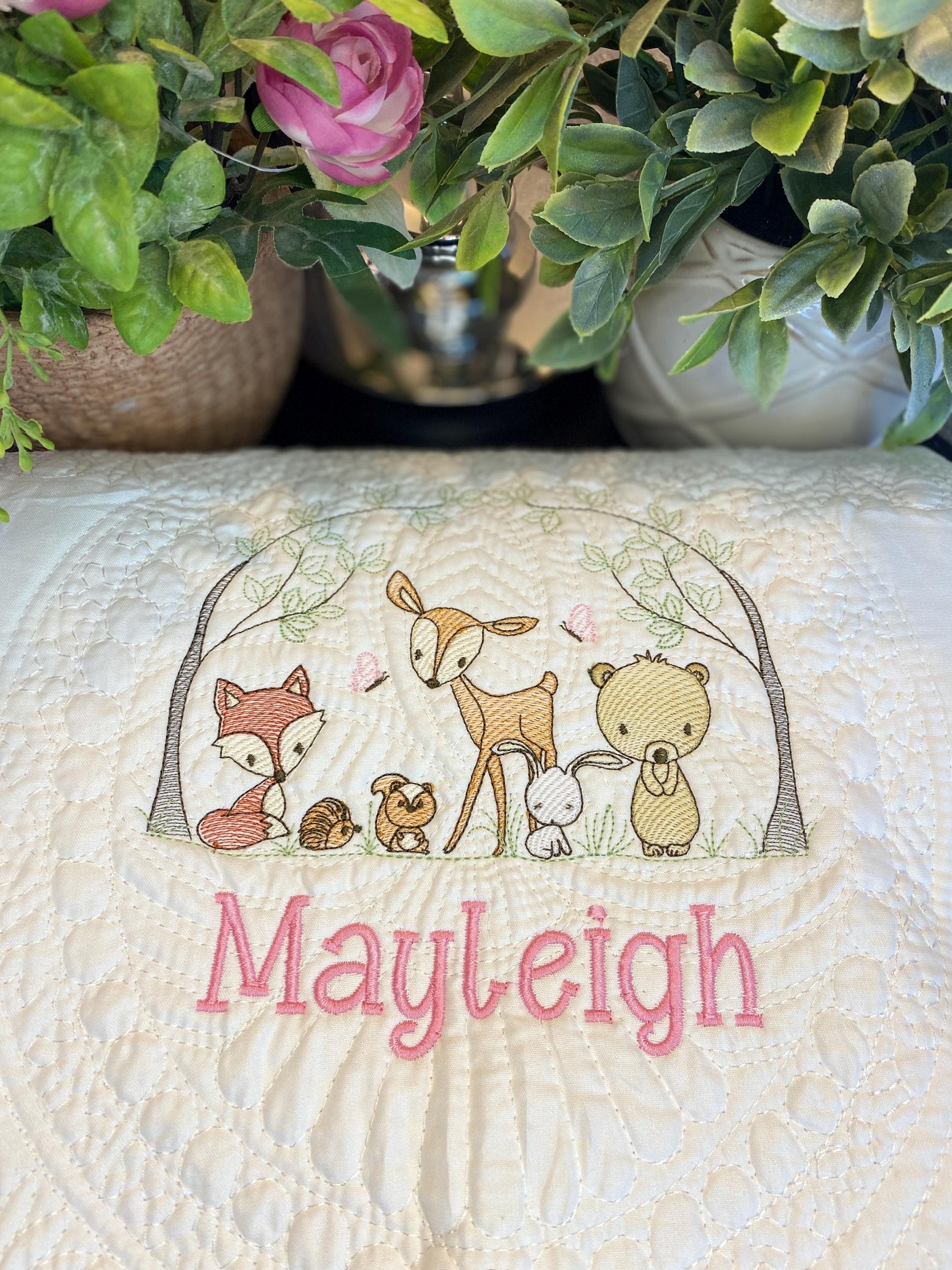 Personalized Woodland Animals Baby Quilt | Custom Name Heirloom Blanket for Boys & Girls featuring embroidered forest animals and a custom name in soft pastel colors.