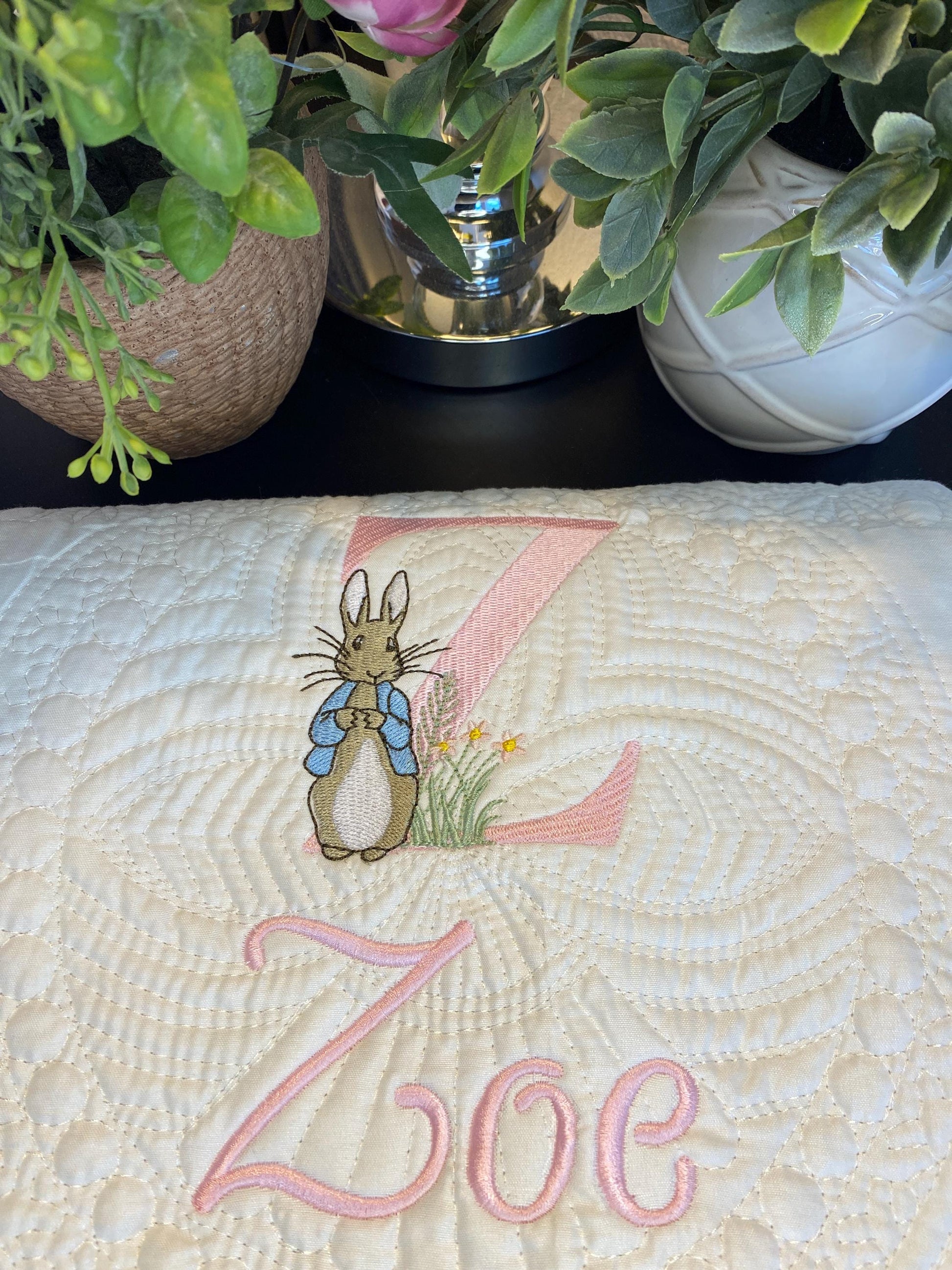 Personalized Embroidered Bunny Baby Quilt | Classic Storybook Heirloom Keepsake | Custom Name Blanket featuring a delicate embroidered bunny, custom initial Z, and the name Zoe on a soft quilted fabric.