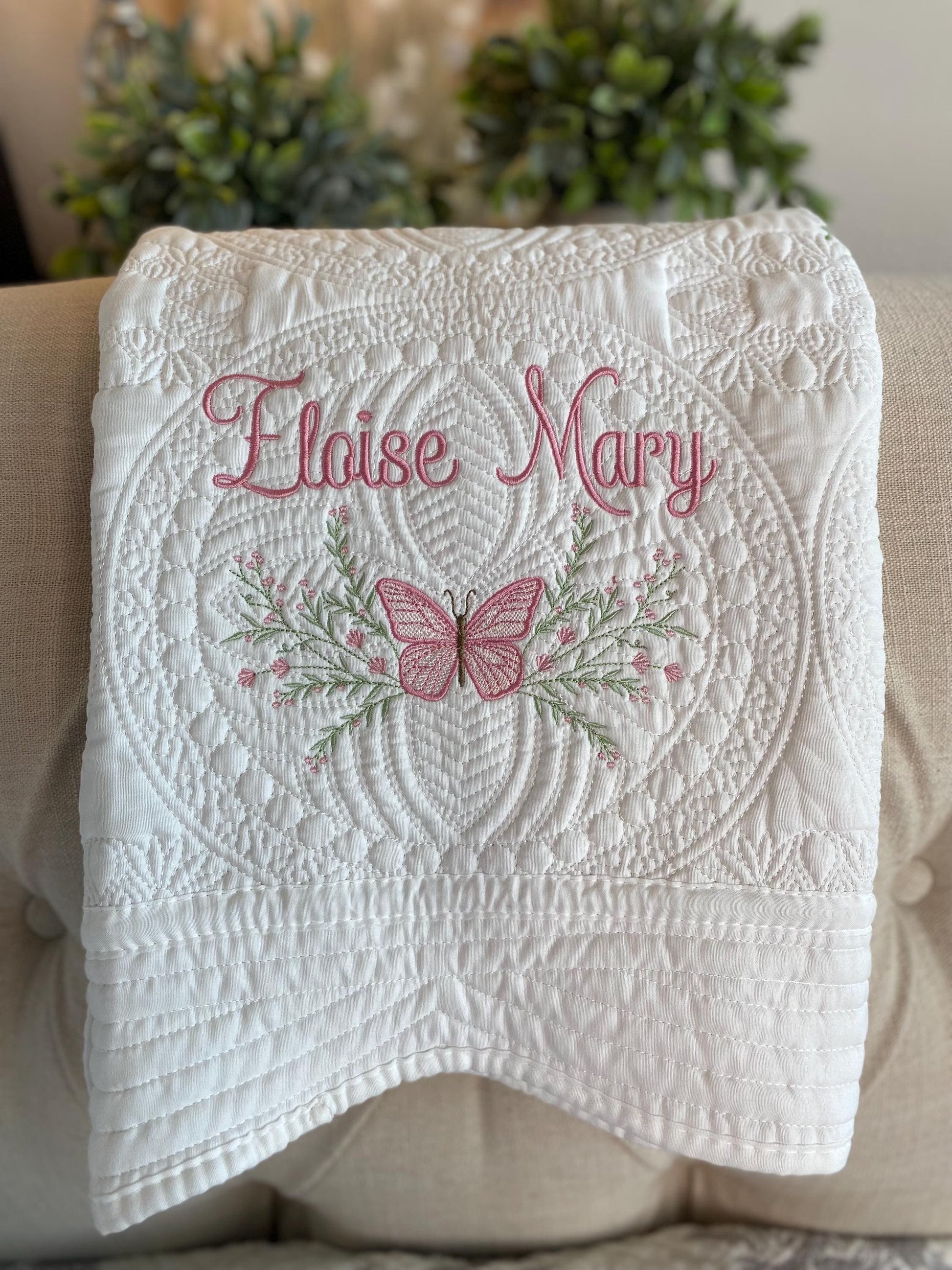 Personalized Pink Butterfly & Botanical Baby Quilt | Custom Name Heirloom Blanket for Girls featuring delicate pink butterfly embroidery and soft botanical patterns with custom name stitching.