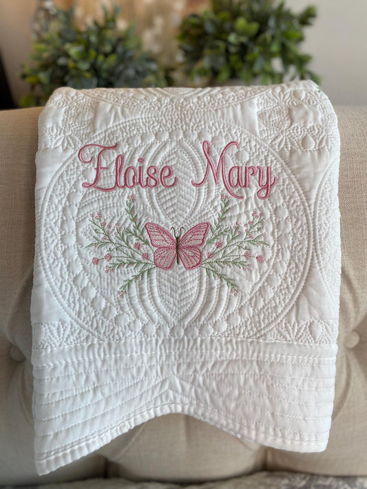 Personalized Pink Butterfly & Botanical Baby Quilt | Custom Name Heirloom Blanket for Girls featuring delicate pink butterfly embroidery and soft botanical patterns with custom name stitching.