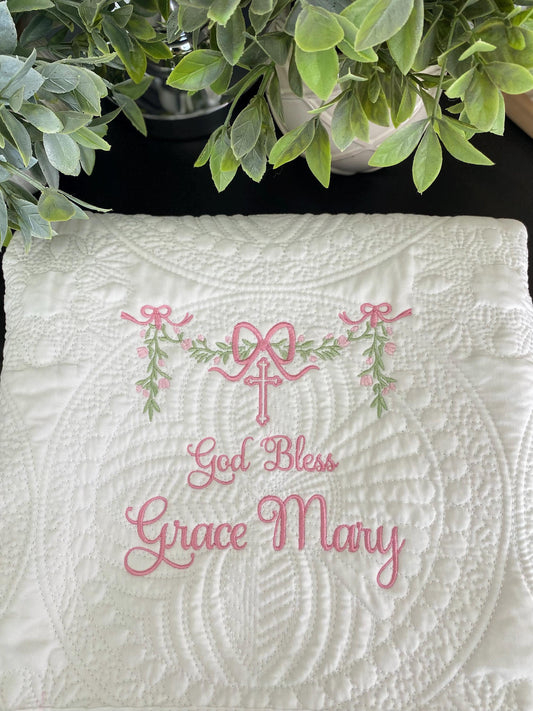 Personalized God Bless Baptism Baby Quilt | Custom Embroidered Christening Heirloom Blanket with delicate pink floral embroidery and a cross, perfect as a baptism gift.